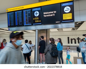 Heathrow Airport. UK- 08.08.2021: The International Arrivals Hall In Terminal 5 With People Waiting To Meet And Greet Passengers.