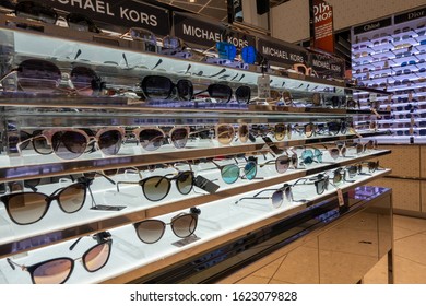 Heathrow, Britain - August 15, 2019: Designer Sunglasses For Sale In Duty Free Store At Airport