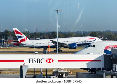 Heathrow, London UK - September 19 2019: British Airways Plane Landing Viewed From The Lounge.