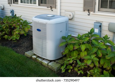 Heating and air conditioning inverter on the side of a house