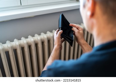 Heating Bill. Increase In The Cost Of Gas Bill. Soaring Energy Prices. Increase In The Price Of Natural Gas. Energy Crisis In Europe. Hands Hold Wallet With Money Near The Radiator. Pay The Bills