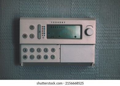 A Heating Controller Isolated. An Old Thermostat On A Wall. Cinematic Look