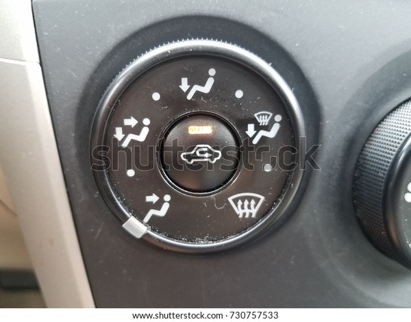 heating and cooling\
airflow button in a car