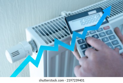 Heating And Energy Costs Rise. Expensive Heating Costs During Cold Season. Hands With Calculator Consider Cost Of Heating. Saving Energy In Times Of Crisis Caused By High Cost Of Energy