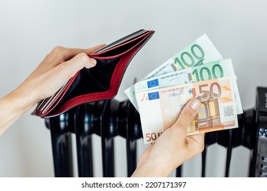 Heating, Energy Crisis In Europe And Consumption Concept. Woman Counting Cash Money For Pay Utility Bills At Home. Rising Costs In Private Households For Gas Bill Due To Inflation And War