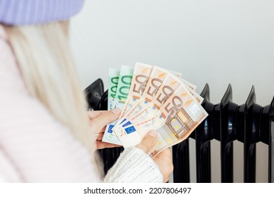 Heating, Energy Crisis In Europe And Consumption Concept. Woman Counting Cash Money For Pay Utility Bills At Home. Rising Costs In Private Households For Gas Bill Due To Inflation And War