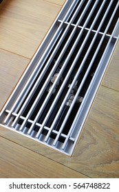 Heating grid with ventilation by the floor in hardwood flooring
