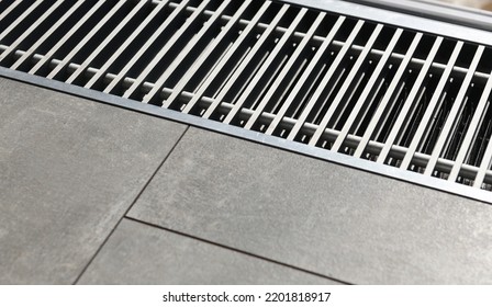 Heating Grill With Ventilation In The Floor In Laminate.. Forced Hot-air Heating Systems Are Extremely Popular And Feature Vents Like This To Channel The Hot Air Throughout The House.