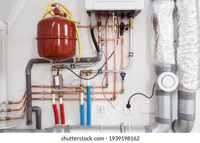 Heating installation and central boiler heating system on wall in house close-up