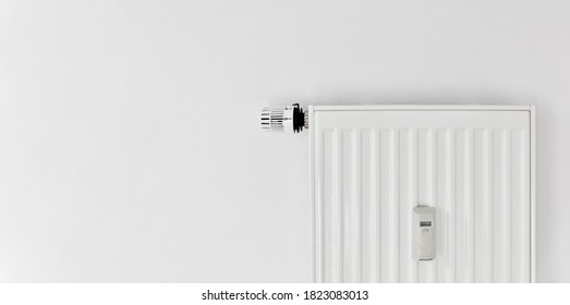 Heating With Panel Radiator And Heat Cost Allocator And Thermostat On The Wall