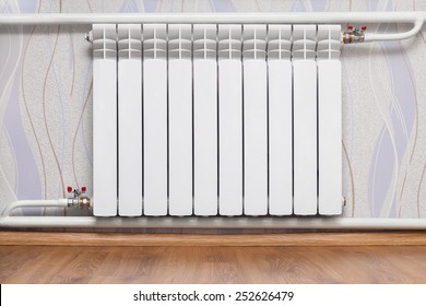 Heating radiator in room. Design of interiors 