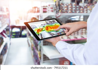 Heatmap Analytic In Smart Retail Shop Technology Concept. Hand Using Smart Tablet With Pheat Sense Application Check Shoppers Passed From Any Point In Store.