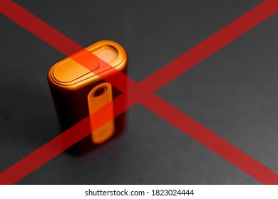 Heat-not-burn Product On Gray Background With Red Cross. Smoking Ban Concept.