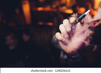 A Heat-not-burn Tobacco Product Technology.Man Holding In One Hand Smoking Module Before Smoking.