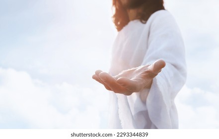 Heaven and cross love and faith and salvation concept of Jesus Christ reaching out with open arms in the sky and the resurrected Jesus Christ
 - Shutterstock ID 2293344839