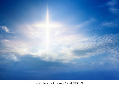 Heavenly Cross . Religion symbol shape .  Dramatic nature background  . Glowing cross in sky . Happy Easter. Light from sky . Religion background .  Paradise heaven . Light in sky .  