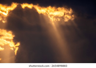 Heavenly Rays of Light Breaking Through Dramatic Dark Clouds at Sunset – Divine Sky Background with Spiritual and Hopeful Atmosphere, Copy Space