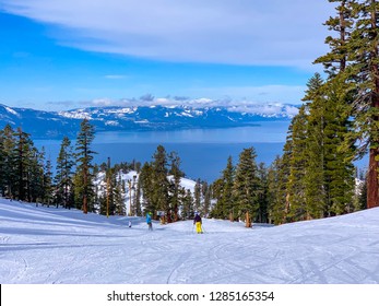 Heavenly Ski Resort, California, USA. Beautiful mountain covered with snow and a view of the blue Tahoe Lake. People skiing in the distance. - Shutterstock ID 1285165354
