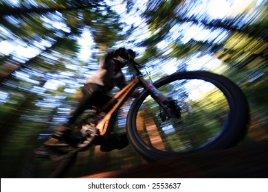 A Heavily Blurred Mountain Biker On A Trail In Vancouvers Famous North Shore Mountains.