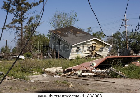 Heavily damaged homes in the Ninth Ward of New Orleans. .Behind these homes is the industrial canal the one that collapsed during the storm surge of hurricane Katrina.