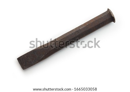 Heavily used stone chisel or masonry chisel (also called flat chisel or cement chisel) isolated on white. has heavily hammered head.