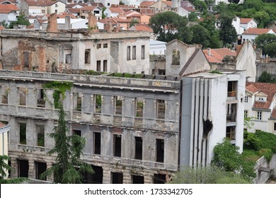 Heavily War Damaged Abandoned Building In Mostar, Bosnia And Herzegovina