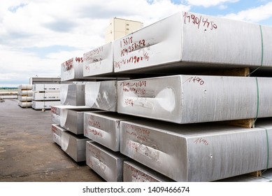 Heavy Aluminum Bars Lying On Each Other On Stack In The Square Of An Aluminum Smelter.