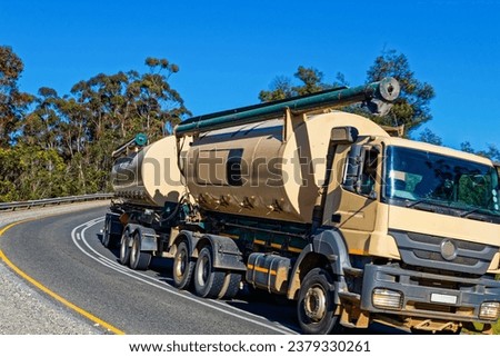 Heavy animal feed vehicle and trailer climbing Garcia's Pass near Riversdale in the Western Cape, South Africa