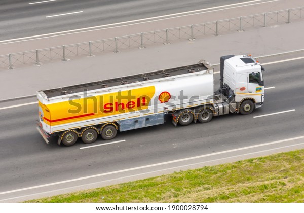 Heavy big fuel tanker\
truck Shell company on city highway. Russia, Saint-Petersburg. 16\
june 2020