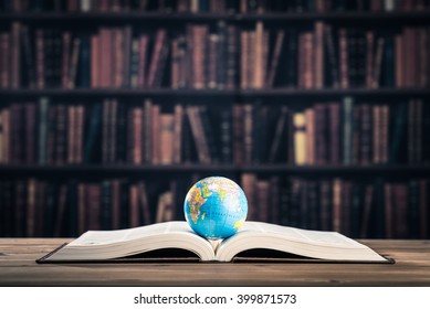 Heavy book and globe
