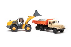 The Heavy Bulldozer Of Yellow Color On A White Background Is Loading Of Heavy Dump-body Truck
