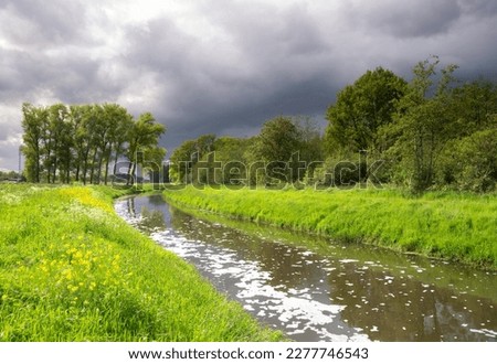 Heavy clouds above the river Aa near Heeswijk Stock photo © 