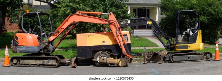 Heavy Construction Machine In Residential Neighborhood. Natural Gas Line Replacement Project.