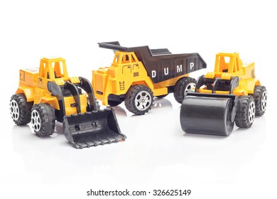 Heavy Construction Machinery Toy On White Background.