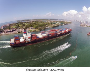 Heavy container ship entering Port of Miami aerial view