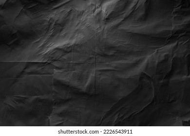 Heavy crumpled black paper texture in low light background - Shutterstock ID 2226543911