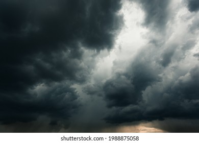 Heavy dark dramatic rainy clouds on the sky background.