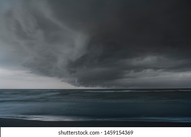 Heavy Dark Fast Moving Thunderstorm Clouds Over Lake Erie Seascape. Severe Weather, Hurricane, Heavy Rain, Strong Winds, Hailstorm Concept. Ontario, Canada. Long Exposure, HDR Landscape Image.