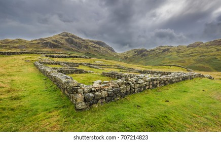 Heavy Dark Storm Clouds Gather Over Hardknott Roman Fort, The Lake District, Cumbria, England