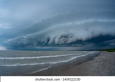 Heavy Dark Thunderstorm Clouds Over Lake Erie Seascape. Severe Weather, Hurricane, Heavy Rain, Strong Winds, Hailstorm Concept. Ontario, Canada. HDR Landscape Image.