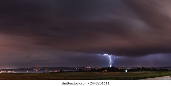 Heavy dramatic thunderstorm with dark lightning discharge . - Powered by Shutterstock - Get 15% off with code: PIKWIZARD15