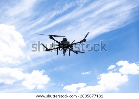 Heavy drone flying performing a flight test for military training. Technology and aerial reconnaissance concept