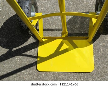 Heavy Duty Empty Yellow Sack Barrow With Shadows Viewed From Above. Close Up.