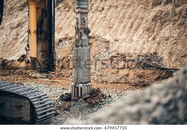 heavy duty machinery used for drilling holes in\
the ground on construction site. Highway building details with\
rotary drilling machine 