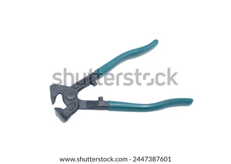 Heavy duty tile nippers cutter tool with green blue rubber grip handles tool used to nip or remove small amounts of a hard material to fit around an odd irregular shape.  Isolated on white background