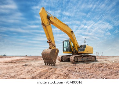 Heavy earth mover with blue sky in the background