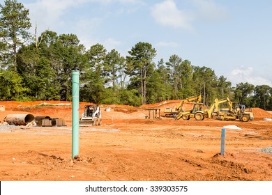 Heavy equipment in graded new residential construction site