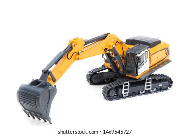 Heavy Excavator. Excavator Model Toy. Construction Machinery, Isolated On White Background