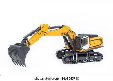 Heavy Excavator. Excavator Model Toy. Construction Machinery, Isolated On White Background