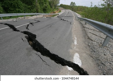 Heavy Flood Damage. Road Collapses With Huge Cracks. Flood Damage Highway. Asphalt Road Collapsed And Fallen After Heavy Flood Or Earthquake